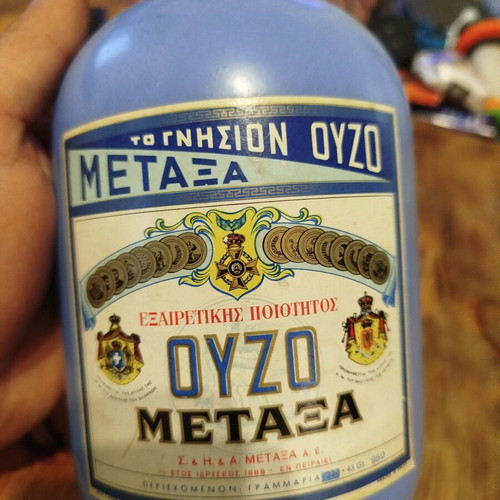 Metaxa ouzo bottle collectible like new, porcelain with wooden stopper