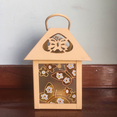 Lantern used with glass panels and embossed butterfly decoration orange-yellow