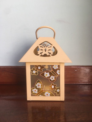 Lantern used with glass panels and embossed butterfly decoration orange-yellow