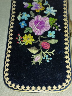 Wallet used with embroidered floral design