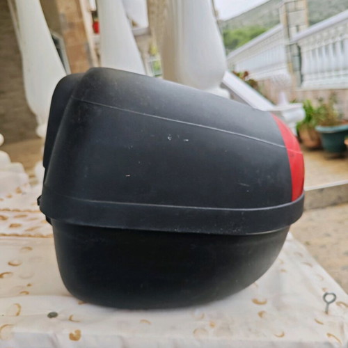 Large motorcycle top case used with key and passenger cushion