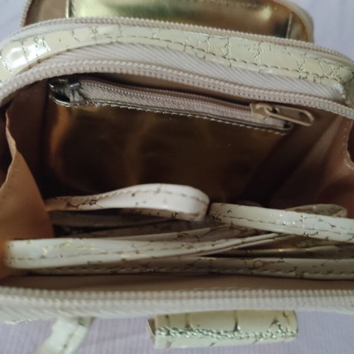 Small gold wristlet shoulder bag