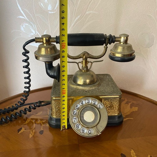 Vintage brass telephone used with embossed designs