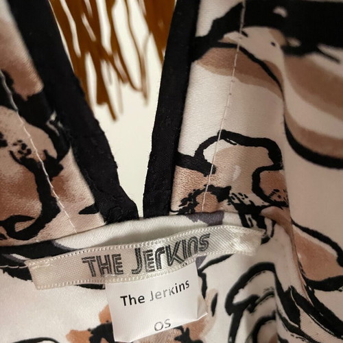 Jerkis vest one size, like new, colorful print with fringes
