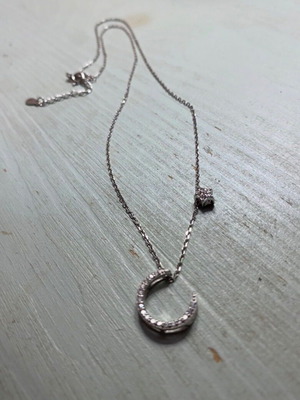 Silver pendant necklace with zircon stones, moon and star design, new