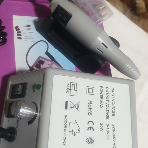 Professional manicure and pedicure set with nail lamp and tools