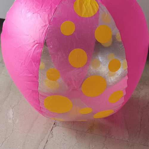 Inflatable beach ball used, pink with yellow dots, 40 cm diameter