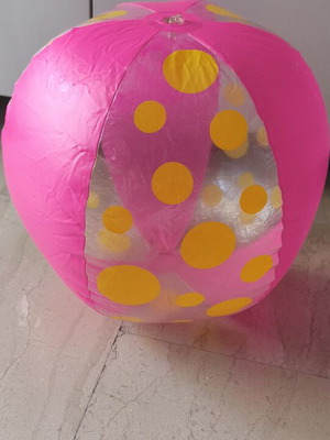 Inflatable beach ball used, pink with yellow dots, 40 cm diameter