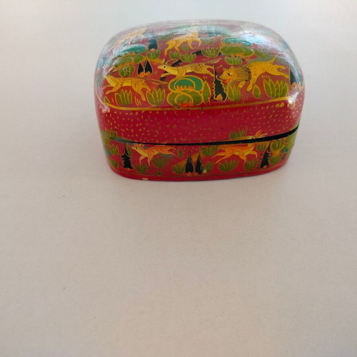 Decorative papier-mache box used with colorful patterns