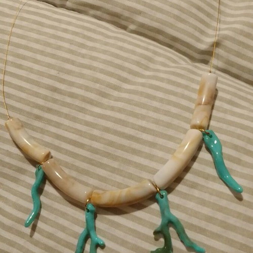 Handmade necklace with acrylic beads and chain on acrylic elements