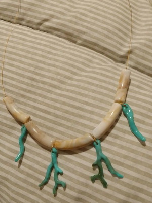 Handmade necklace with acrylic beads and chain on acrylic elements