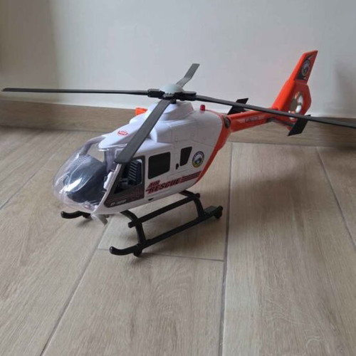 Helicopter toy used with buttons, sounds, and light