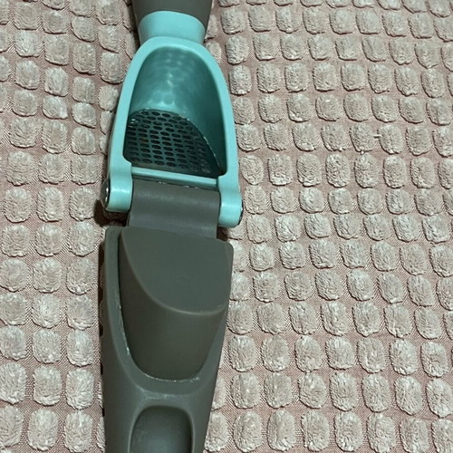 Garlic press used with ergonomic handle and easy cleaning