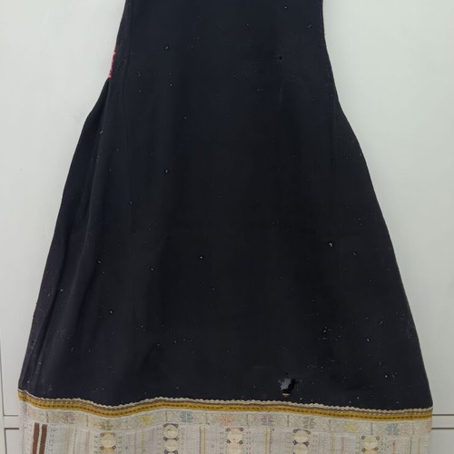 Traditional collectible wool dress used with wear due to age