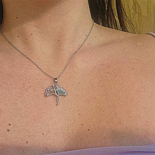 Silver necklace like new with tree design and green stones