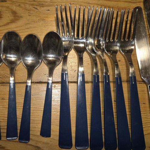 Blue cutlery set used, missing small spoon