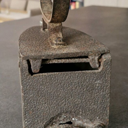 Vintage coal iron used with wooden handle and patina