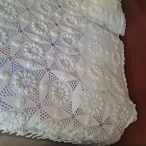 Handmade super double blanket with embossed designs and crocheted fringes