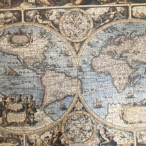 World puzzle with frame used, brown color and glass