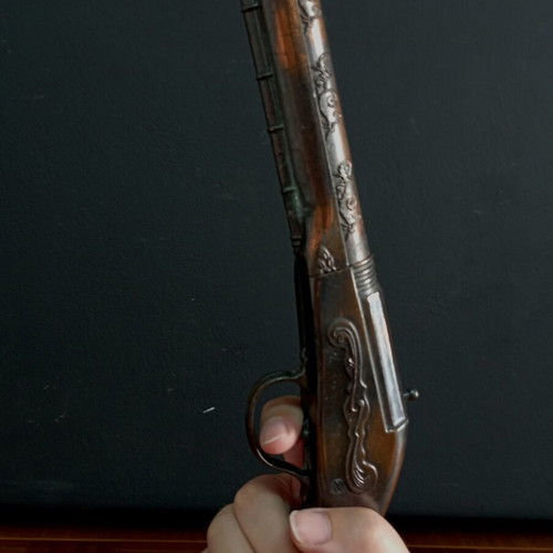 Vintage replica pistol used with engraved designs