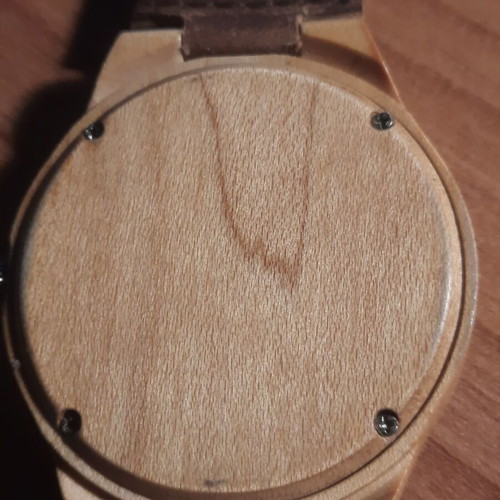 Two vintage wind-up watches and one bamboo watch used
