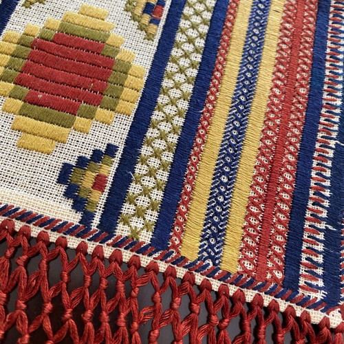 Vintage handmade embroidered runner with geometric design and fringes