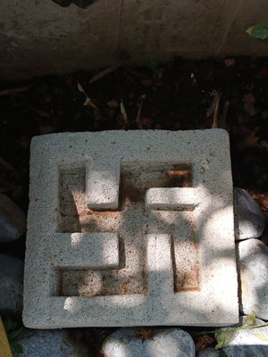 Decorative plaster cup used, hand-carved peace symbol