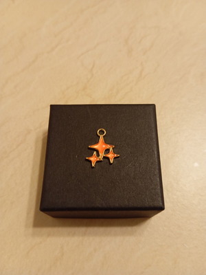 Pendant with star design, gold plated, new