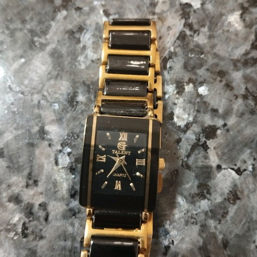 Women's wristwatch used, black and gold, 22cm bracelet