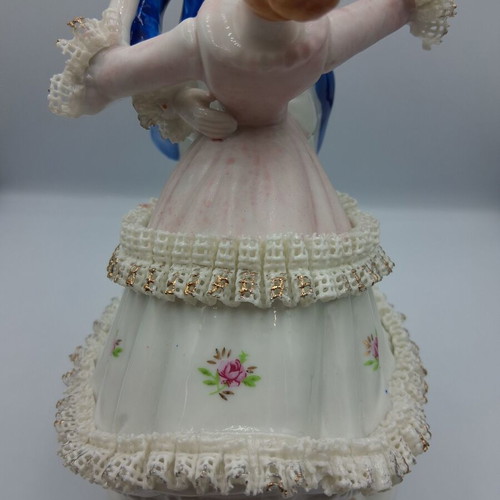 Vintage porcelain music figurine of dancing couple, like new