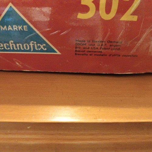 Race track toy with 3 wind-up cars used, 1960, metal