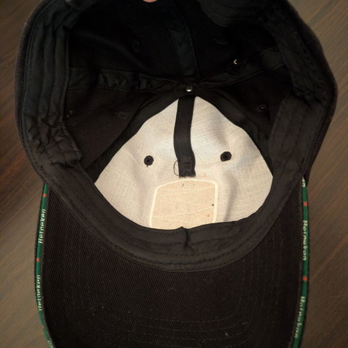 Black jockey hat with Heineken UEFA Champions League shield