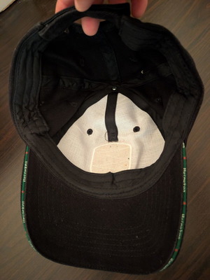 Black jockey hat with Heineken UEFA Champions League shield