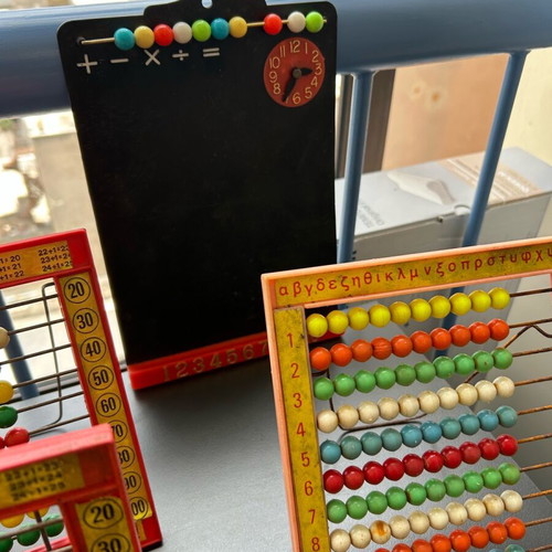 Vintage toys used, 1970s abacus counters, plastic phone