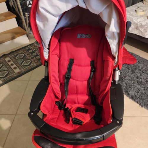 Kiddo Smart Deluxe stroller used with footmuff and changing bag, red