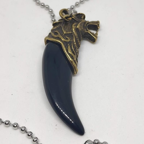 Necklace with wolf tooth pendant like new, gold and black