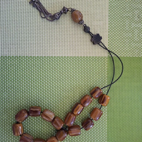 Komboloi with Brown-Honey Beads like new, 17 beads, metal decorations