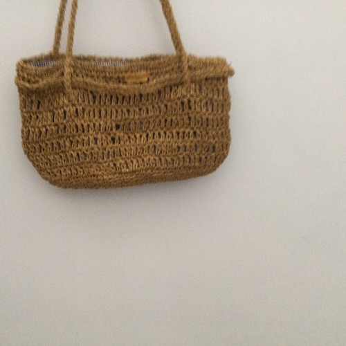 Knitted bag like new with golden yarn and fabric lining