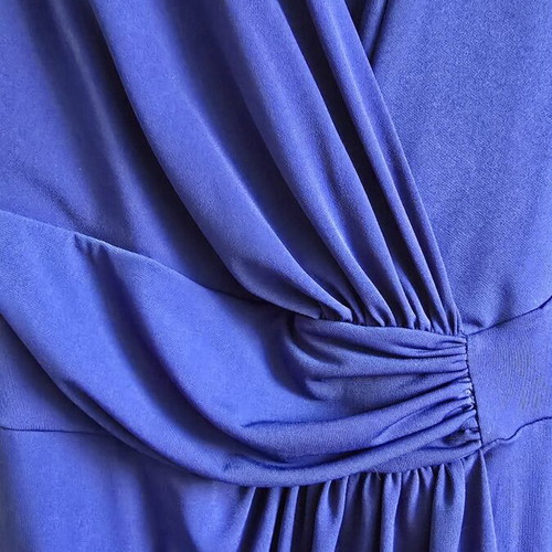 Blue elegant dress with short sleeves and wrap design