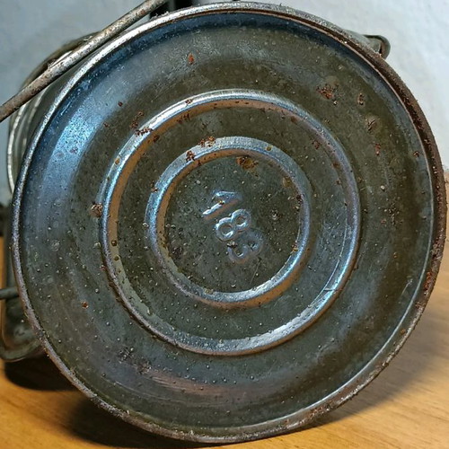 Vintage storm lantern used with cracked glass