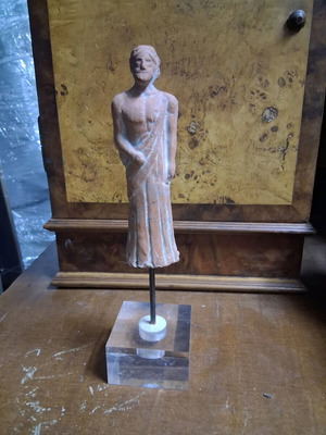 Copy of ancient deity used, terracotta on plexiglass base