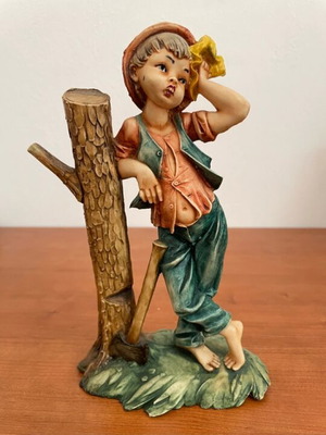 Figurine boy with axe and tree stump