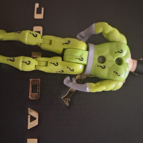 Riddler Toy Biz Batman figure used with minor paint wear