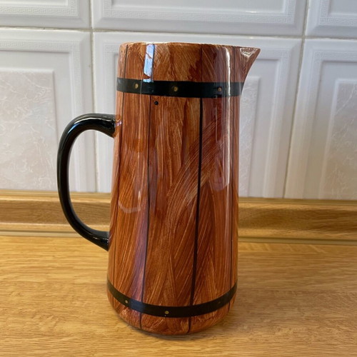Vintage ceramic pitcher like new with wooden barrel design