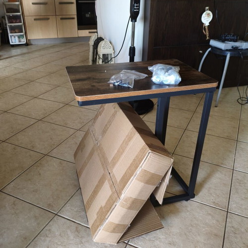 Wooden side table with metal base and wheels