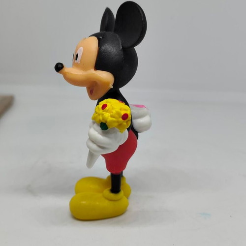 Collectible Mickey Mouse figure like new with bouquet