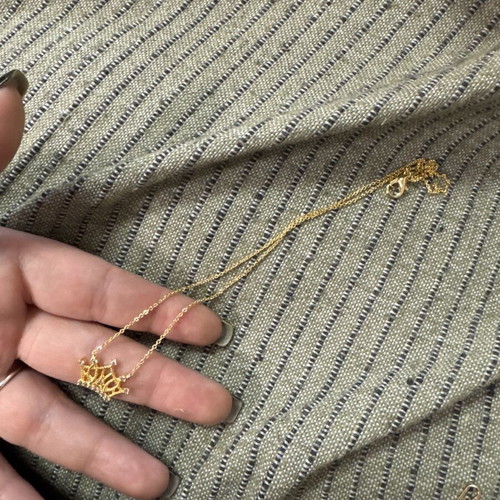 Necklace in gold color with crown design like new