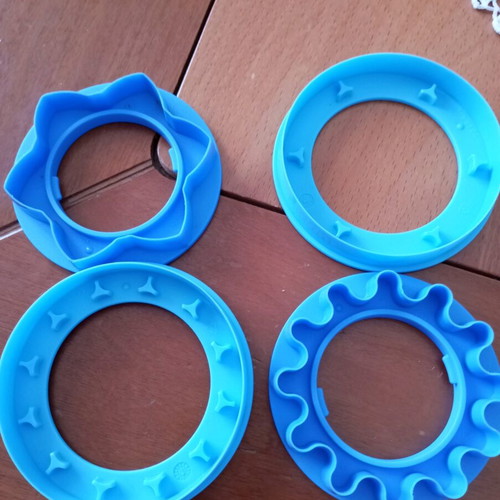 Tupperware cookie cutters like new, set of 3 with tree, boot and little person designs