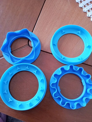 Tupperware cookie cutters like new, set of 3 with tree, boot and little person designs