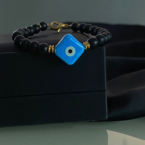 Handmade bracelet with haolite semi-precious stones and ceramic eye motif